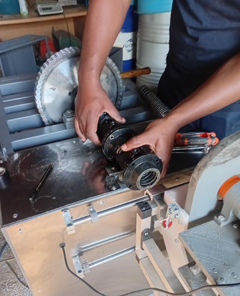 Extruder barrel sections being assembled by hand
